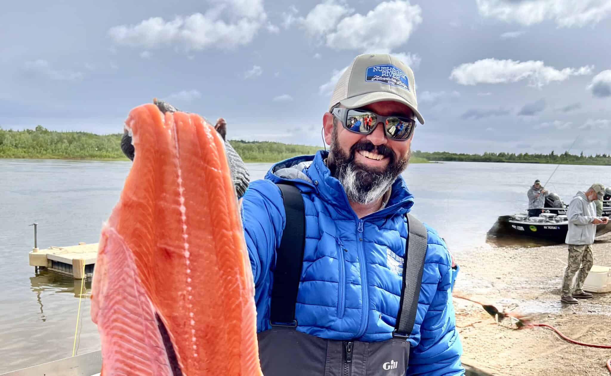 Guide Joaquin Capelle with a salmon fillet on the Nushagak