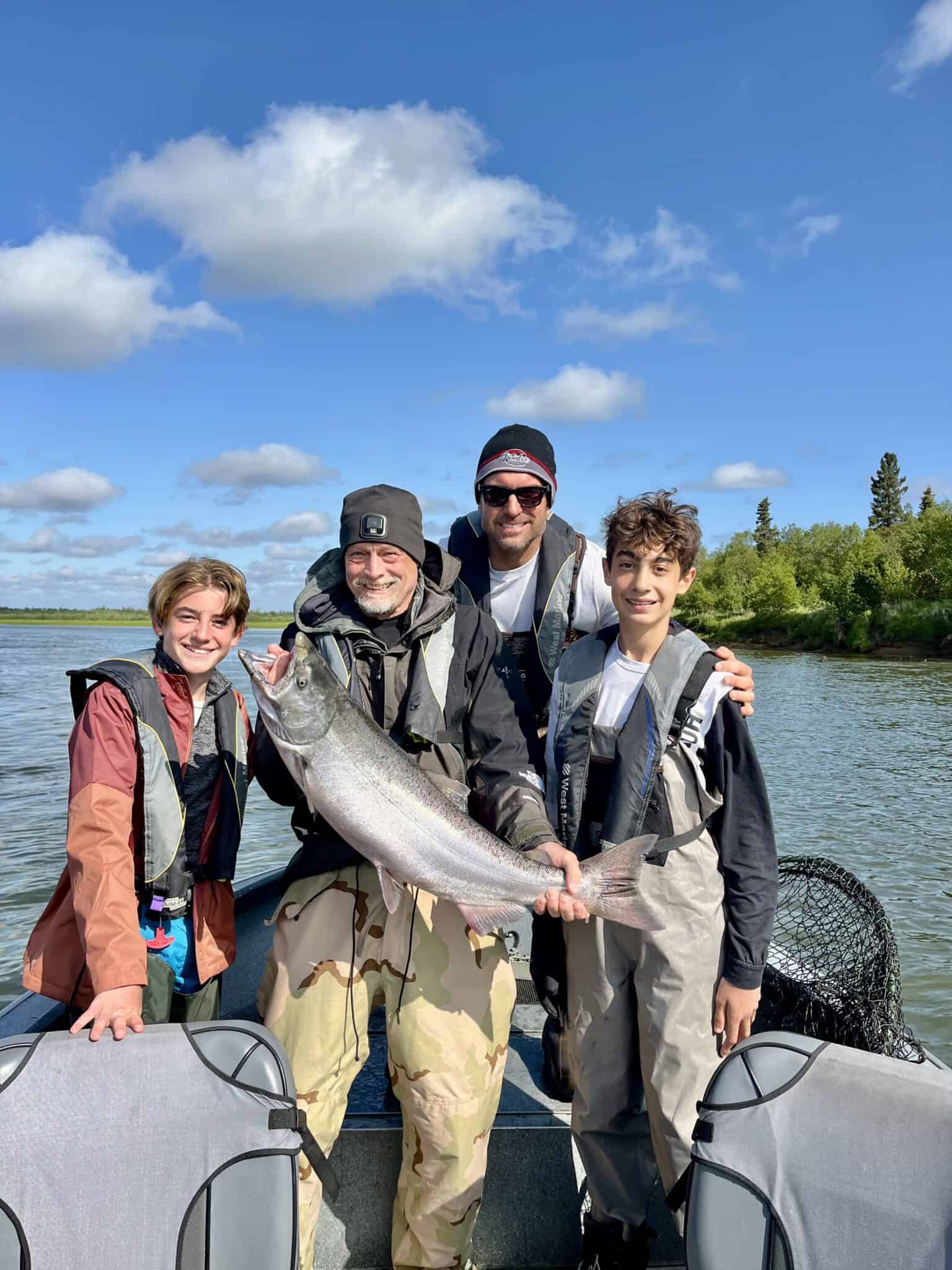 A family with their king salmon on the Nushagak River