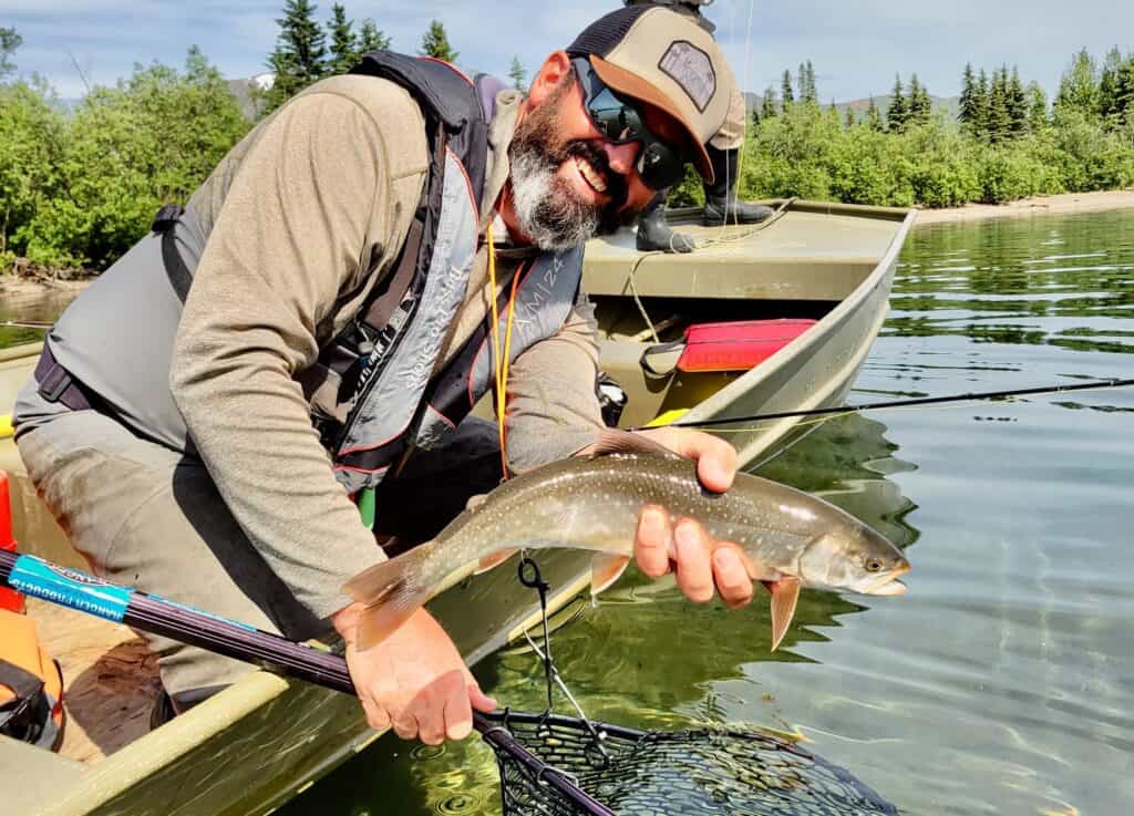 Man holding freshly caught fish