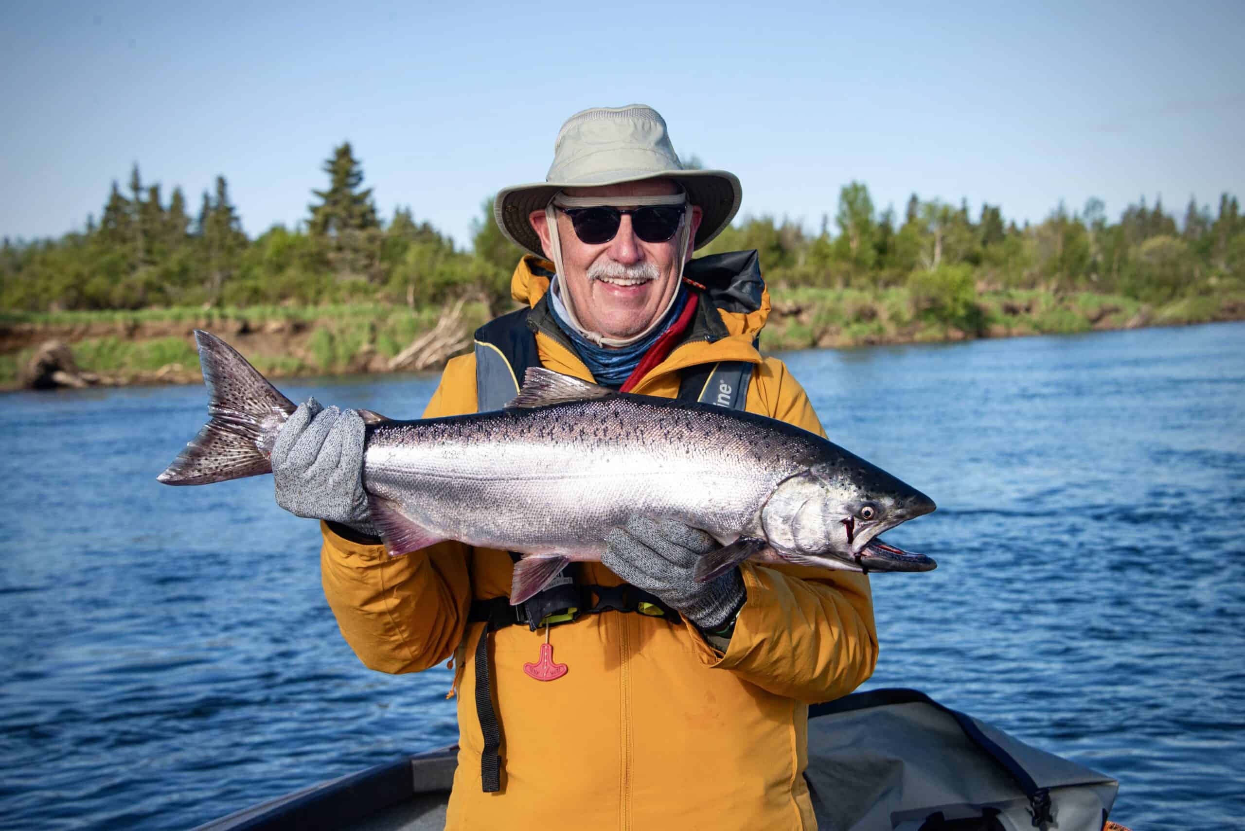 Man holding large salmon.